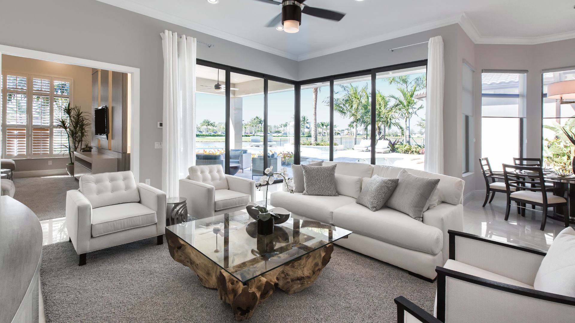 A living room filled with furniture and a glass table